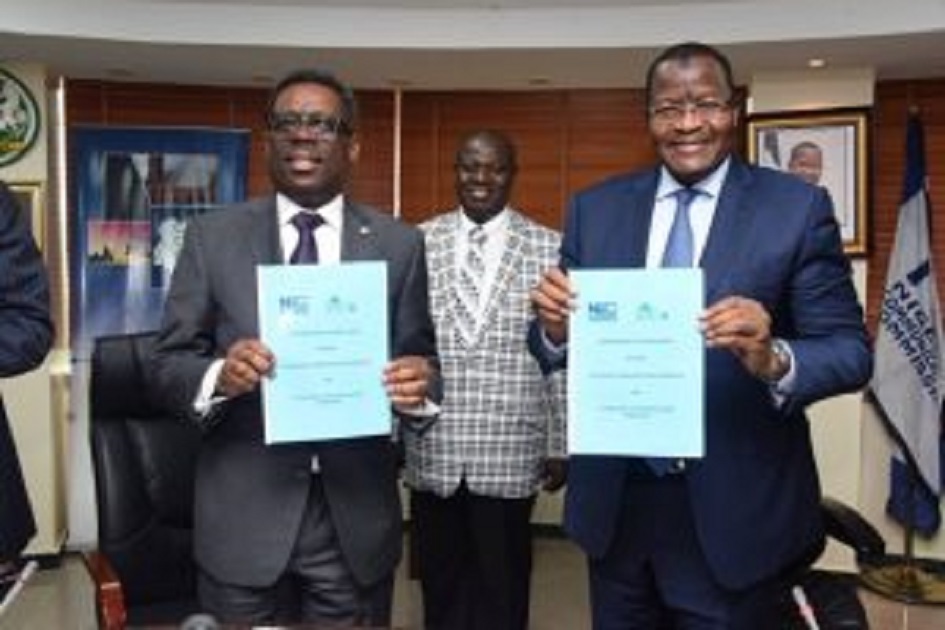 L-R: The acting director-general, National Lottery Regulatory Commission, Lanre Gbajabiamila and the executive vice chairman, Nigerian Communications Commission, Prof. Umar Danbatta holding the signed memorandum of understanding during the ceremony in Abuja.