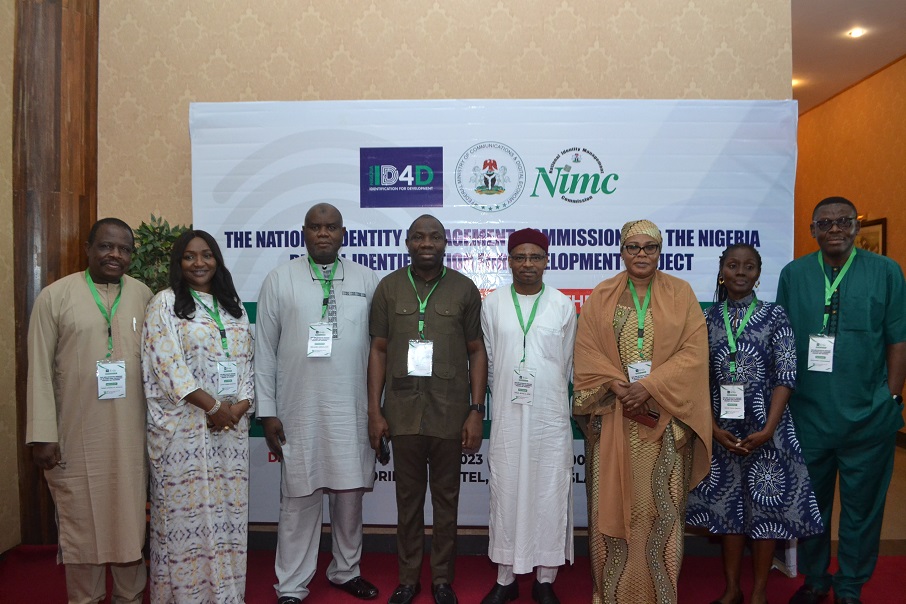 NIMC DG, Aliyu Aziz (4th R), ID4D Project Coordinator, Musa Solomon (4th L) and a cross section of NIMC Management Team at the Procurement Workshop