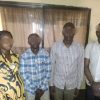 Four microfinance staff