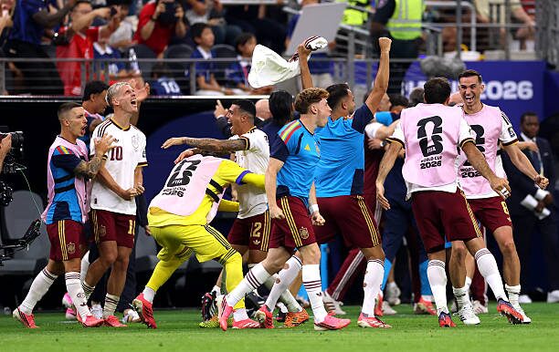 Spain players celebrate after defeating France 2-0 in the FIFA World Cup semifinal to qualify for the final.