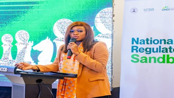 The Director General of the National Information Technology Development Agency (NITDA), Kashifu Inuwa, CCIE, represented by the National Coordinator of the Office for Nigerian Digital Innovation (ONDI), Mrs. Victoria Fabunmi, delivering his remarks at the National Regulatory Sandbox Governance and Implementation Planning Workshop held in Abuja.