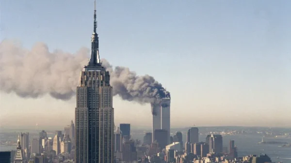 25 years after 9/11 attack, US panel demands fresh security reforms September 11, 2026 10:20 am 25 years after 9/11 attack, US panel demands fresh security reforms The twin towers of the World Trade Center burn behind the Empire State Building in New York, Sept. 11, 2001. In a horrific sequence of destruction, terrorists crashed two planes into the World Trade Center causing the twin 110-story towers to collapse. (AP Photo/Marty Lederhandler)