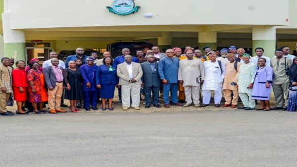 Group photo of DG NITDA represented by Director, Special Duties department, Dr Aristotle Onumo (middle) alongside management staff of thr university during the 3rd International Biennial COLPHYS 2026