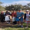 Foued Abrouk (second from right) harvests olives with his family in their Tunisian olive farm.